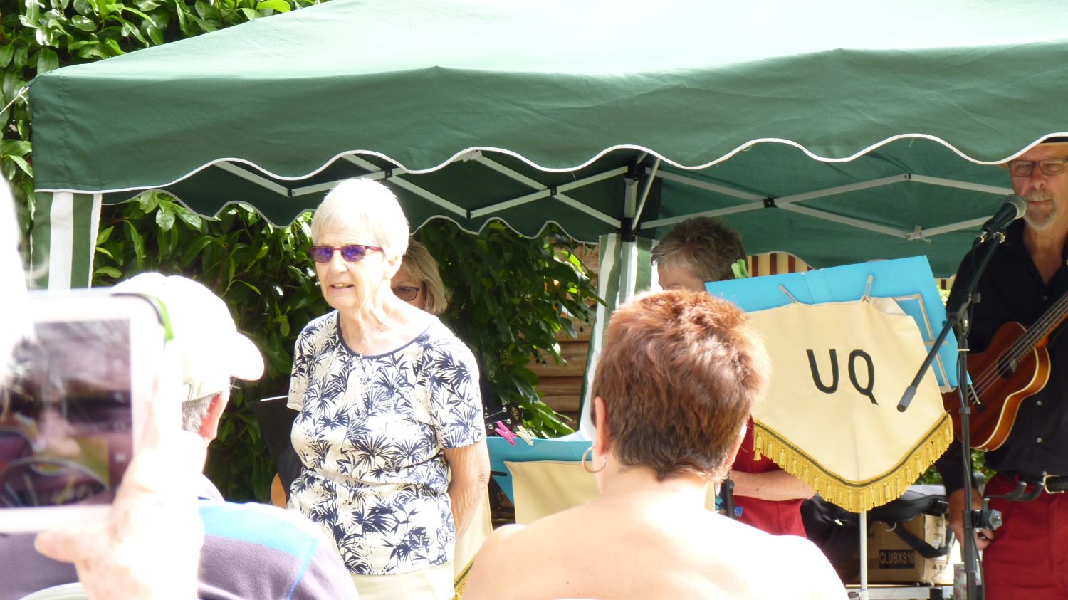 Our Chairman Gill Noble welcoming visitors to the garden and the free music event