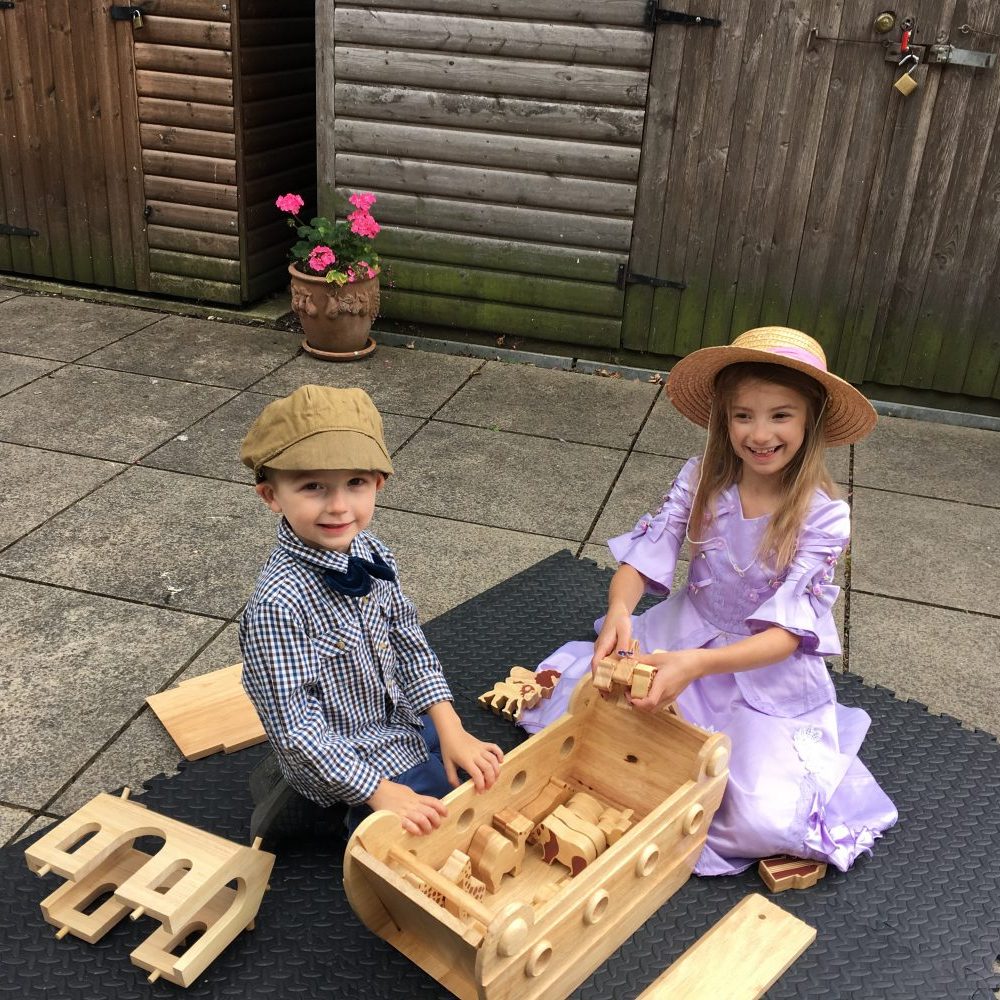 image All dressed up and enjoying the old toys