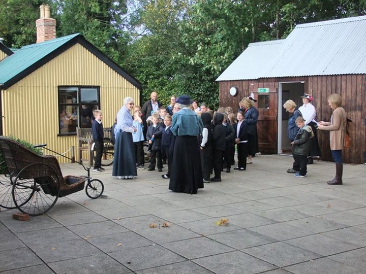 Children being greeted by Gill Noble and her education team.